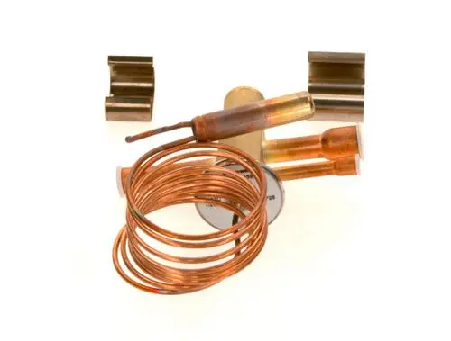 Copper tubing, fittings, and an expansion valve are arranged on a white background, associated with Bosch products, likely for HVAC or refrigeration applications.